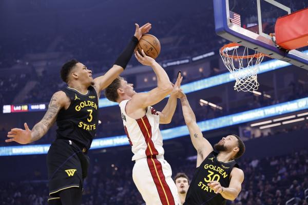 Warriors overcome loss of Jimmy Butler III ( knee ) to beat Heat